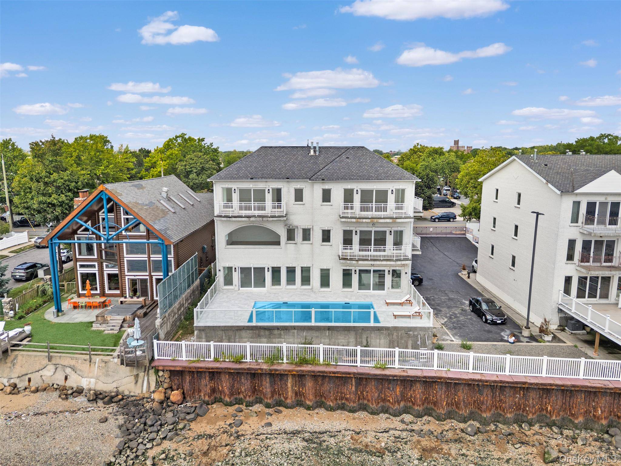 Waterfront Single Family Condo Over 7K SqFt of Modern Living Private In ground Pool This rare single family, stand alone condominium offers over 7, 000 square feet of modern living ...