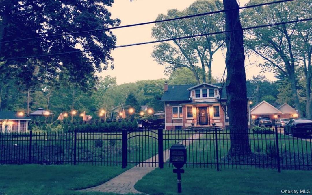 Welcome to this beautifully maintained three bedroom brick Cape, tucked away on a quiet dead end street offering exceptional privacy.