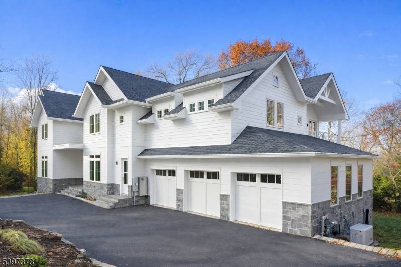 Exceptional new construction minutes from NYC offering approximately 9, 600 square feet across three finished levels.