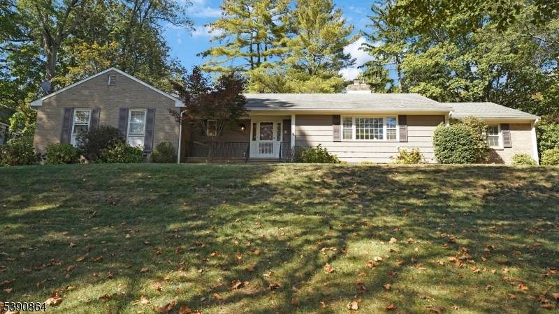 Beautifully maintained ranch featuring spacious rooms, rich wood molding, and marble foyer entry.