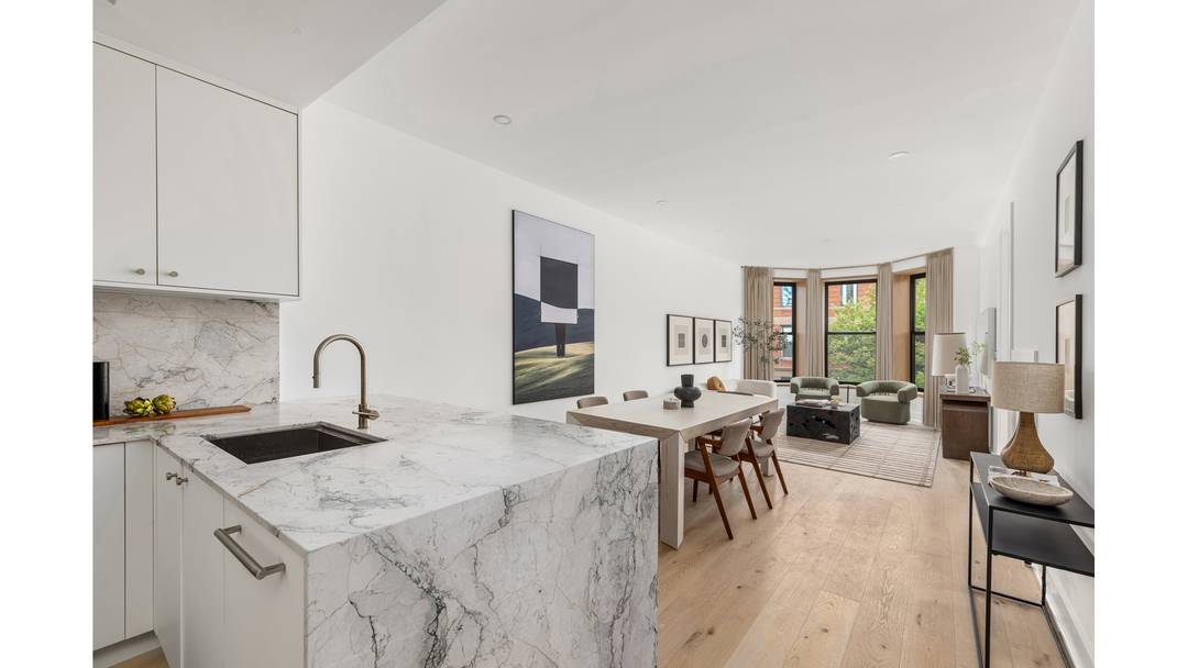 The Penthouse at 22 Saint Johns Place is a rare offering a full floor, penthouse three bedroom, two bathroom home with a private roof deck and sweeping skyline views.