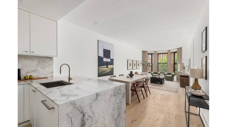 The Penthouse at 22 Saint Johns Place is a rare offering a full floor, penthouse three bedroom, two bathroom home with a private roof deck and sweeping skyline views.