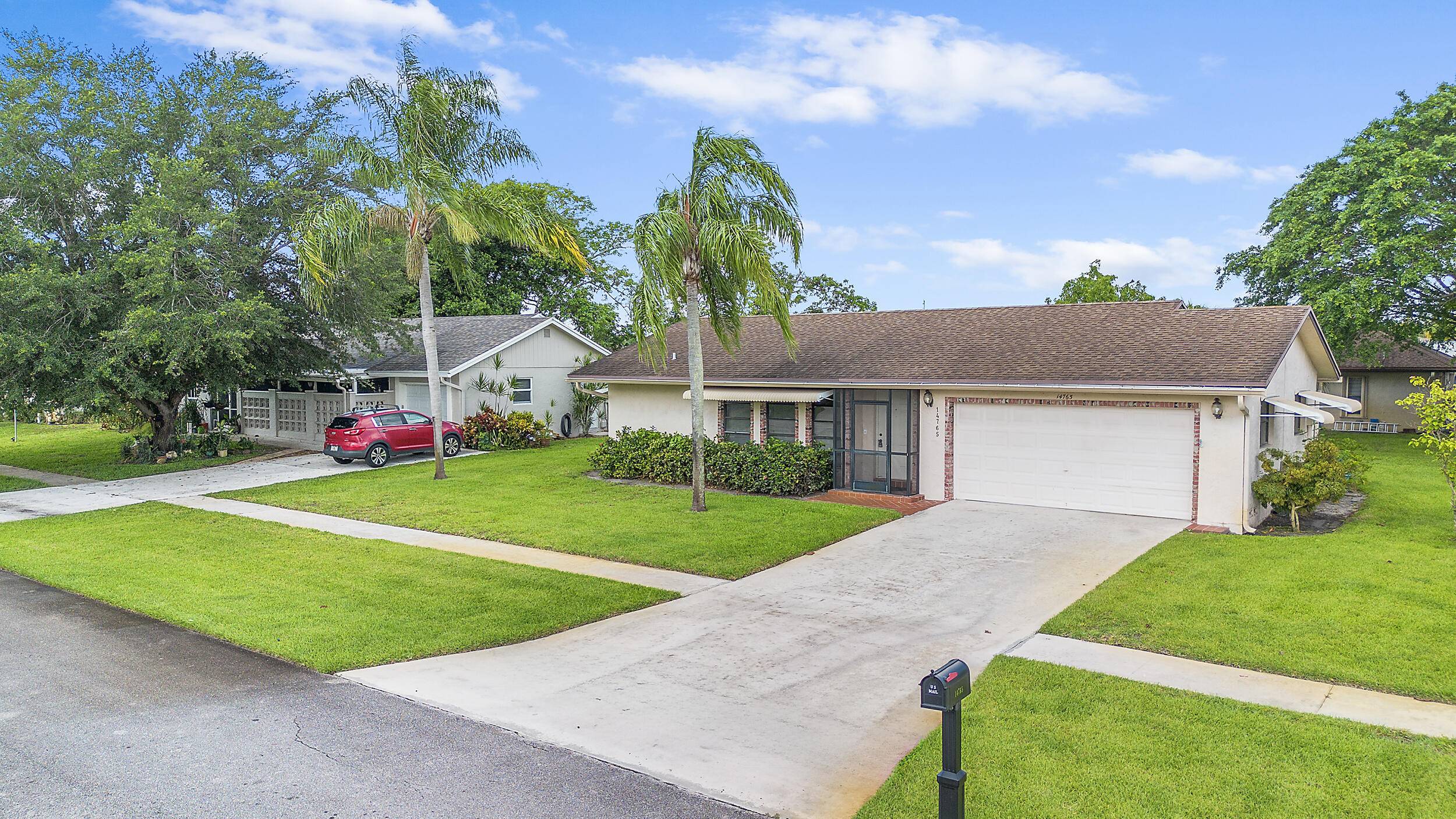 Beautifully maintained home in the sought after 55 active community of Coco Wood Lakes !