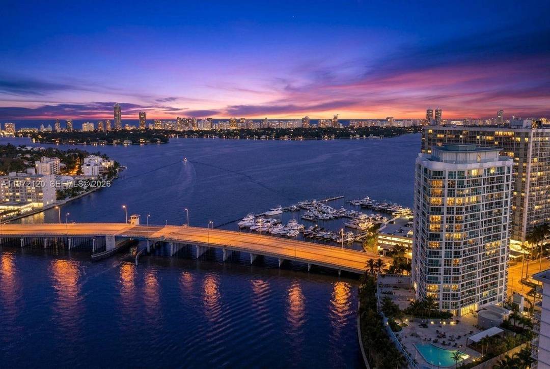 JUST REDUCED ! ! RESORT LIFESTYLE LIVING Stunning 2 bedroom, 2 bath water view condo in North Bay Village.