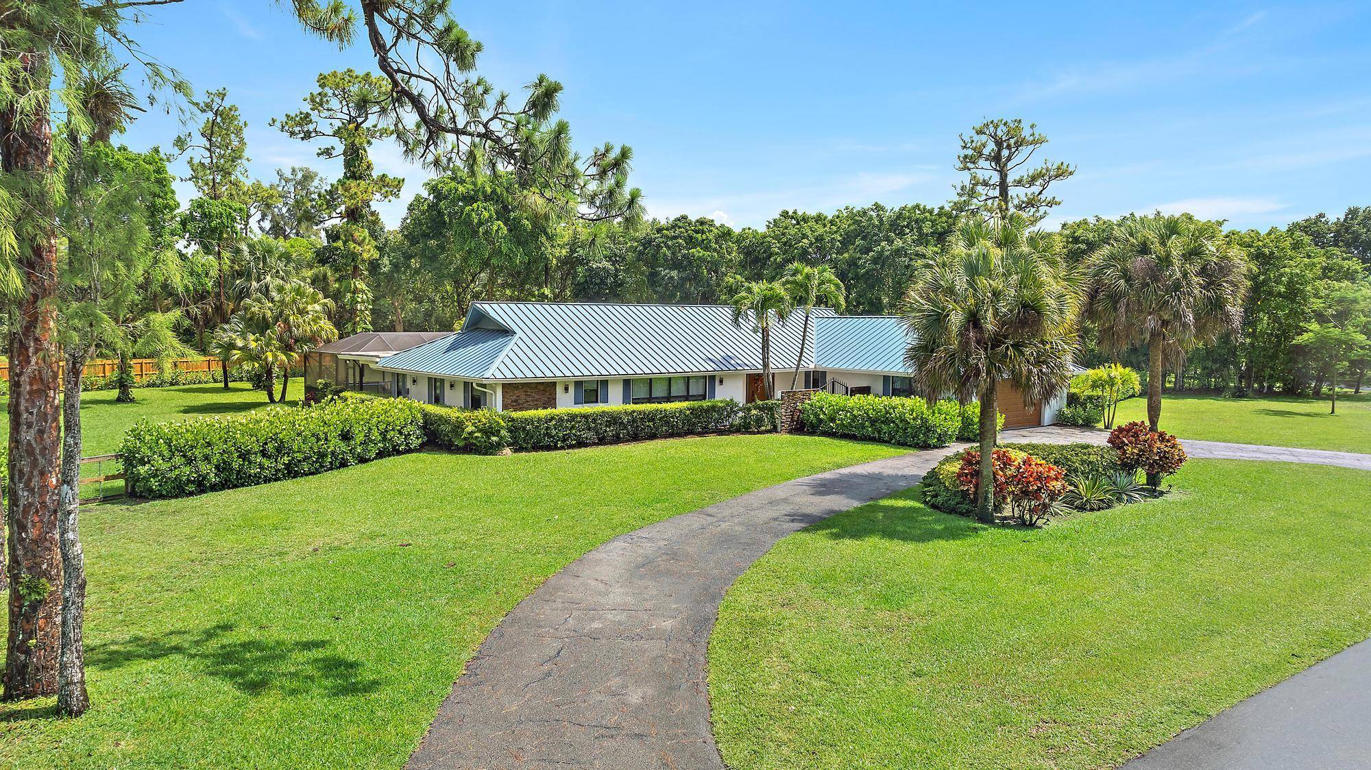 Enjoy equestrian style living with city convenience on this massive 1.