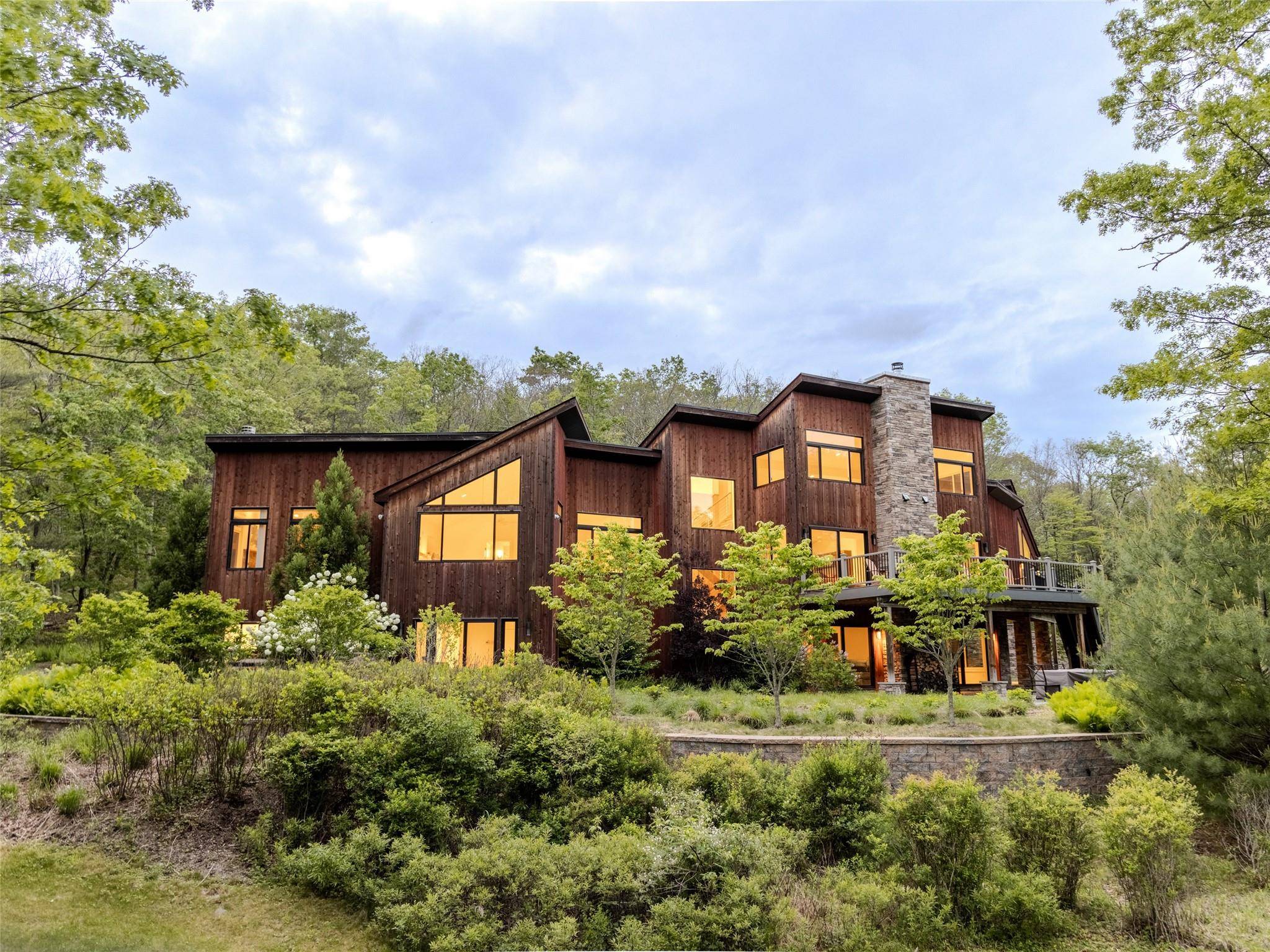 Nestled on a sprawling 171 acre estate, this magnificent 3, 707 sq ft home seamlessly blends modern luxury with rustic charm.