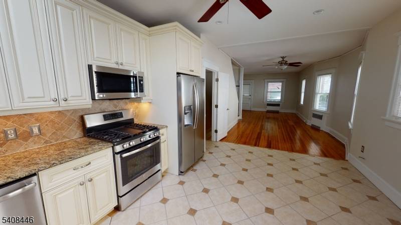 AVAILABLE MARCH 1ST. 2 blocks from train, town center, Open front porch welcomes you to this fabulous duplex with open floor plan and wood floors.