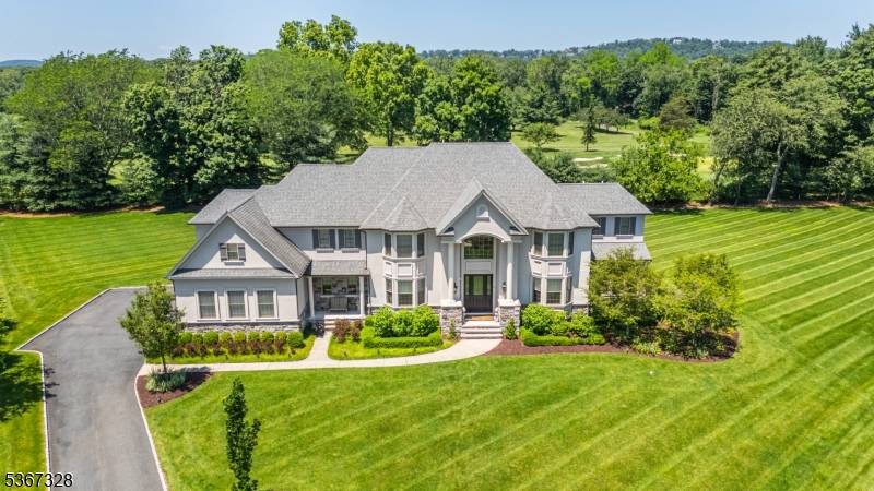 Welcome to your dream home in Denville's prestigious Fairway View Estates !