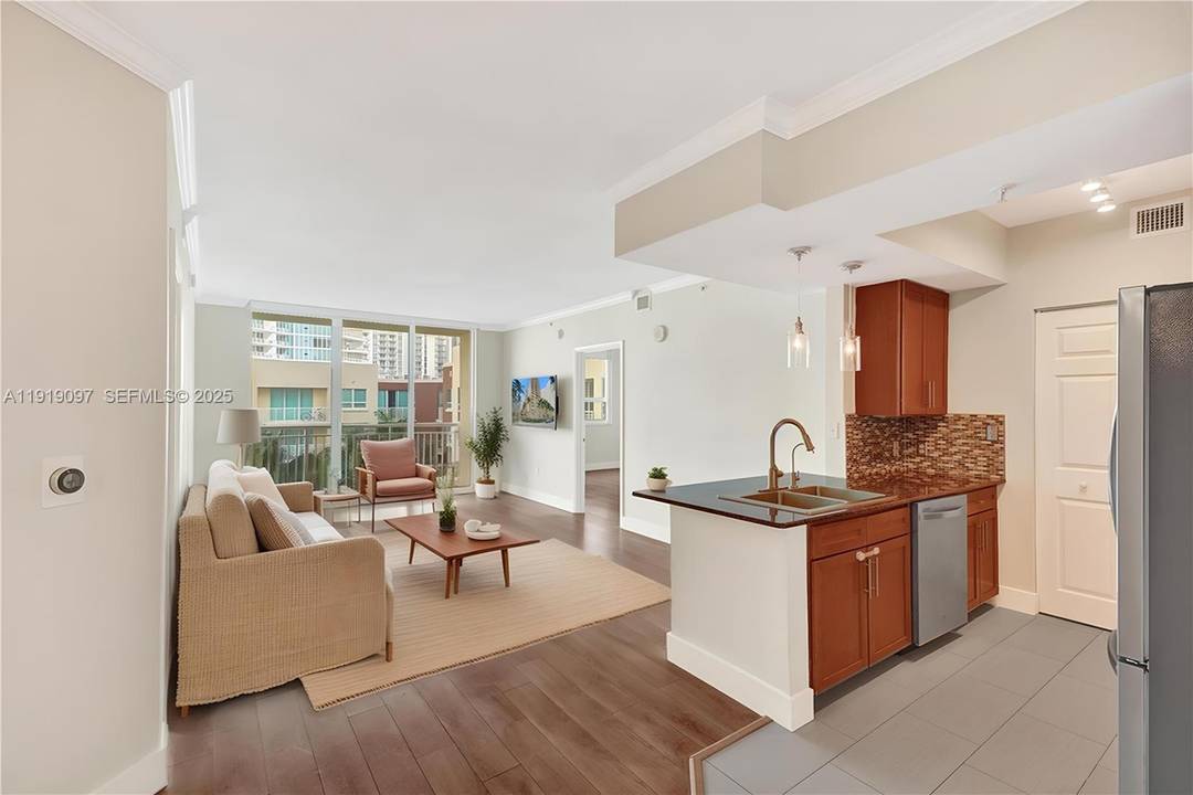 Professionally updated 2 bedroom 2 bathroom residence featuring a desirable split floor plan with an open kitchen appointed with granite countertops and light porcelain tile flooring throughout.