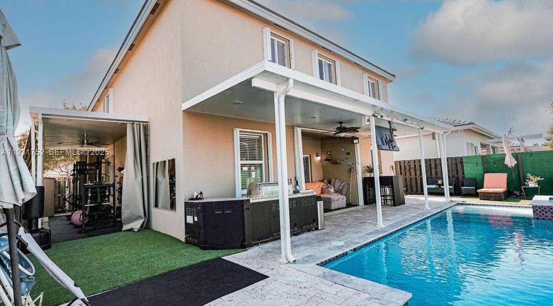 Welcome to this spacious and well appointed 5 bedroom, 3 bath residence offering a 2 car garage, private pool, and dedicated home gym.