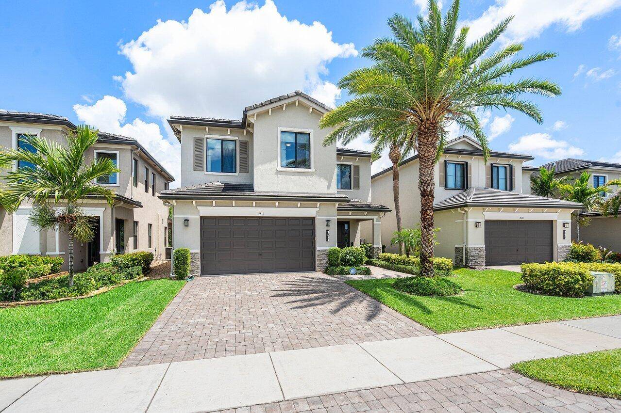 WELCOME to this stunning former builder's model home located in the sought after Silverleaf Community in Lake Worth, FL !