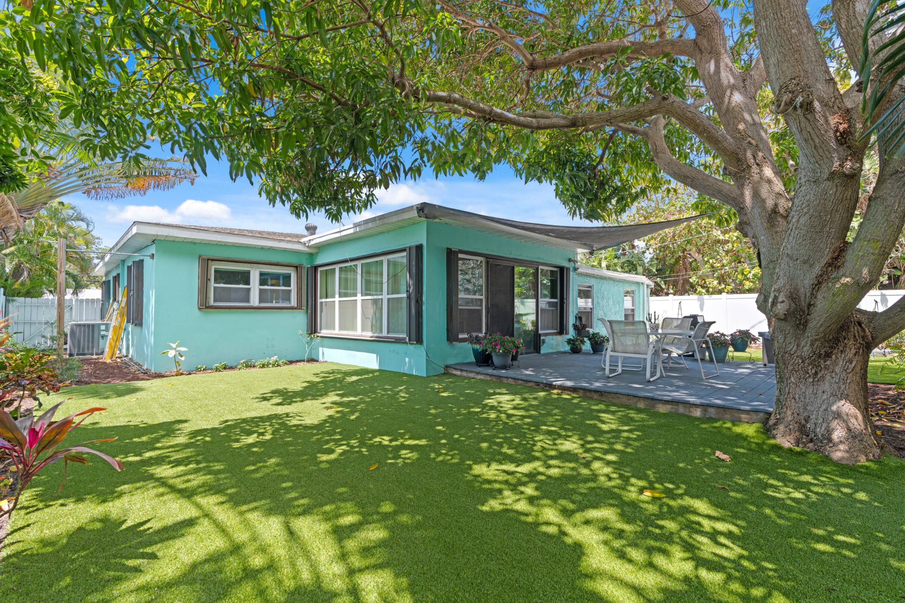 Lovely mid century ranch style home with 3 bedrooms, 2 baths, and a 1 car garage.