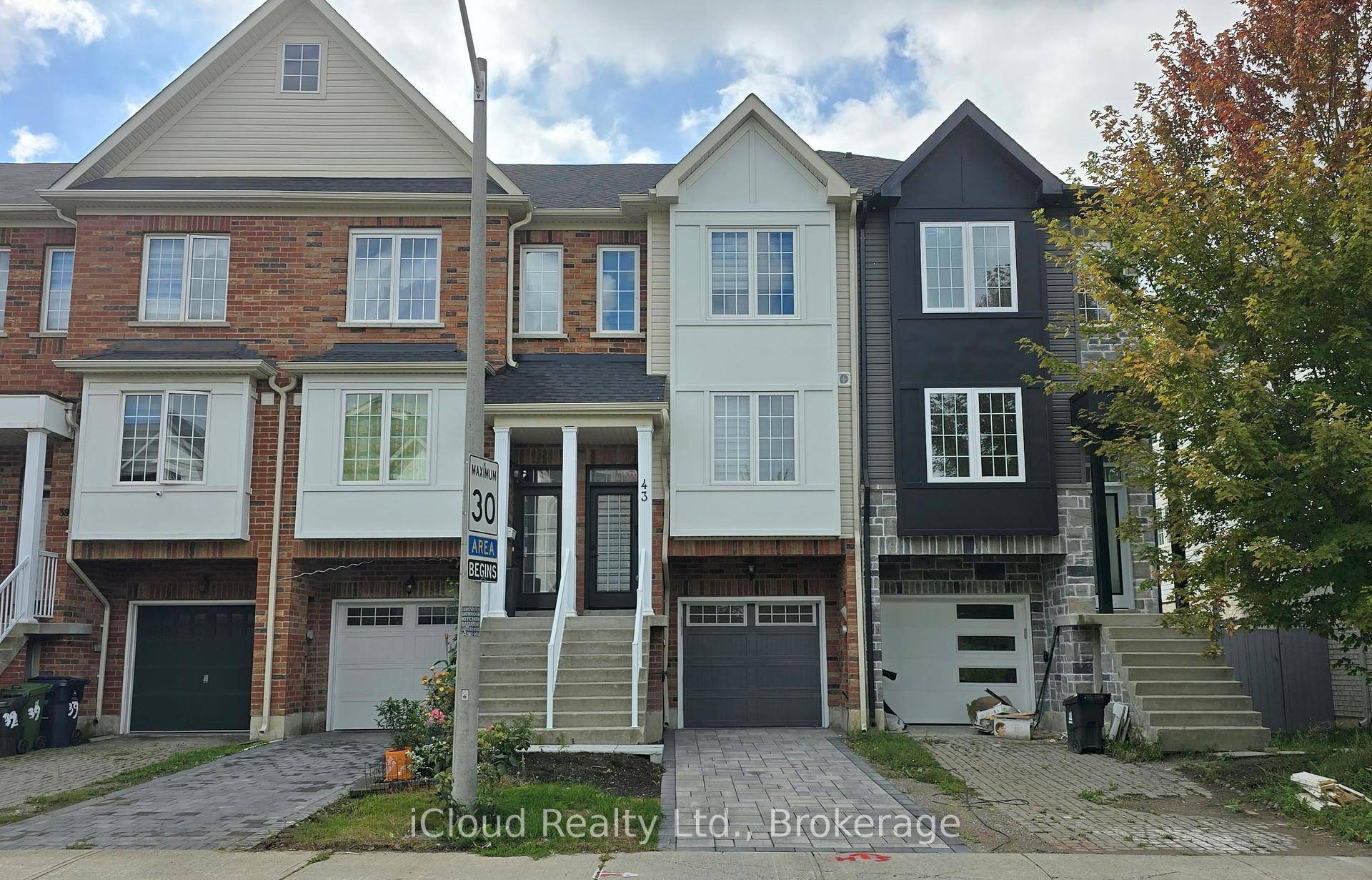 Step into this beautifully renovated 5 Bedroom and a 4 Bathroom Freehold townhouse, rebuilt from top to bottom with modern finishes after a previous fire incident.