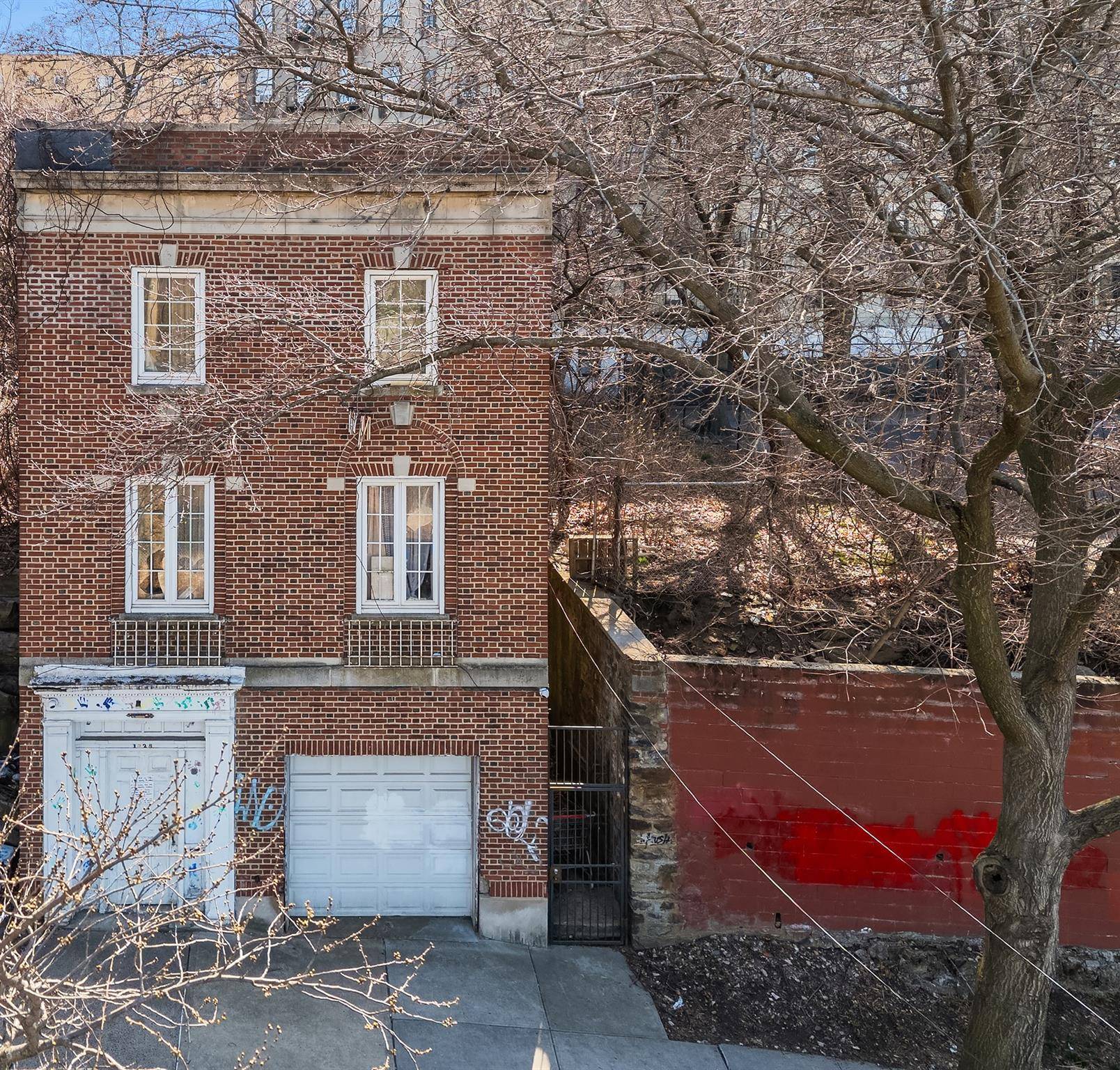 Two story prewar house available for purchase for renovation or as a new development site.