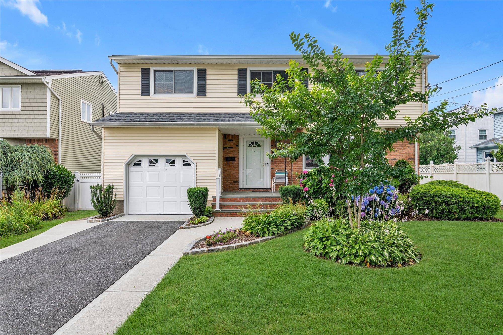 When the temperatures soar, step into this cool and comfortable four bedroom, two and a half bath Side Hall Colonial.