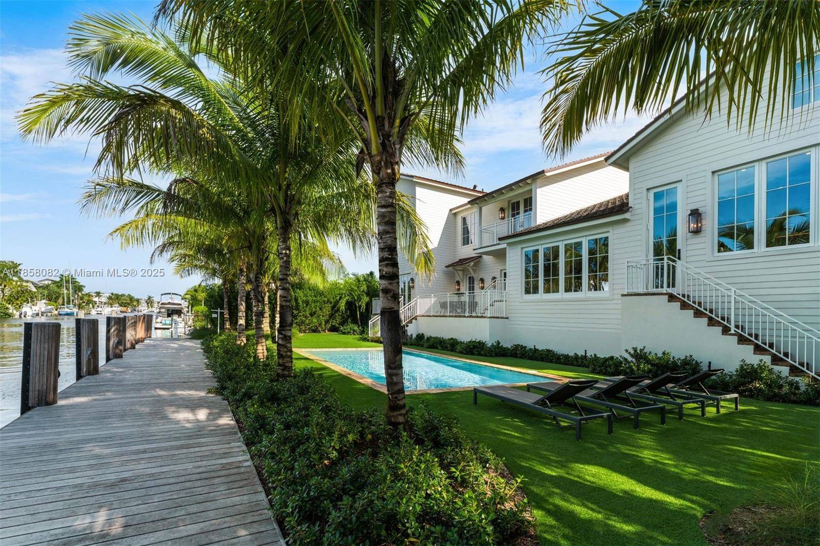 A Yachtsman s dream home totally new 2025 rebuild sits high on a 12, 000 SF direct ocean access lushly landscaped tree shaded interior lot on a quiet cul de ...