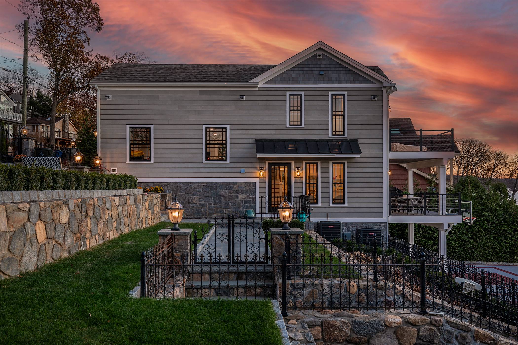 Exceptional Waterfront Estate in Candlewood Shores w 115 ft frontage, renovated Main House Guest House completed 2024 showcases the ultimate in Lake Front Living on Candlewood Lake.