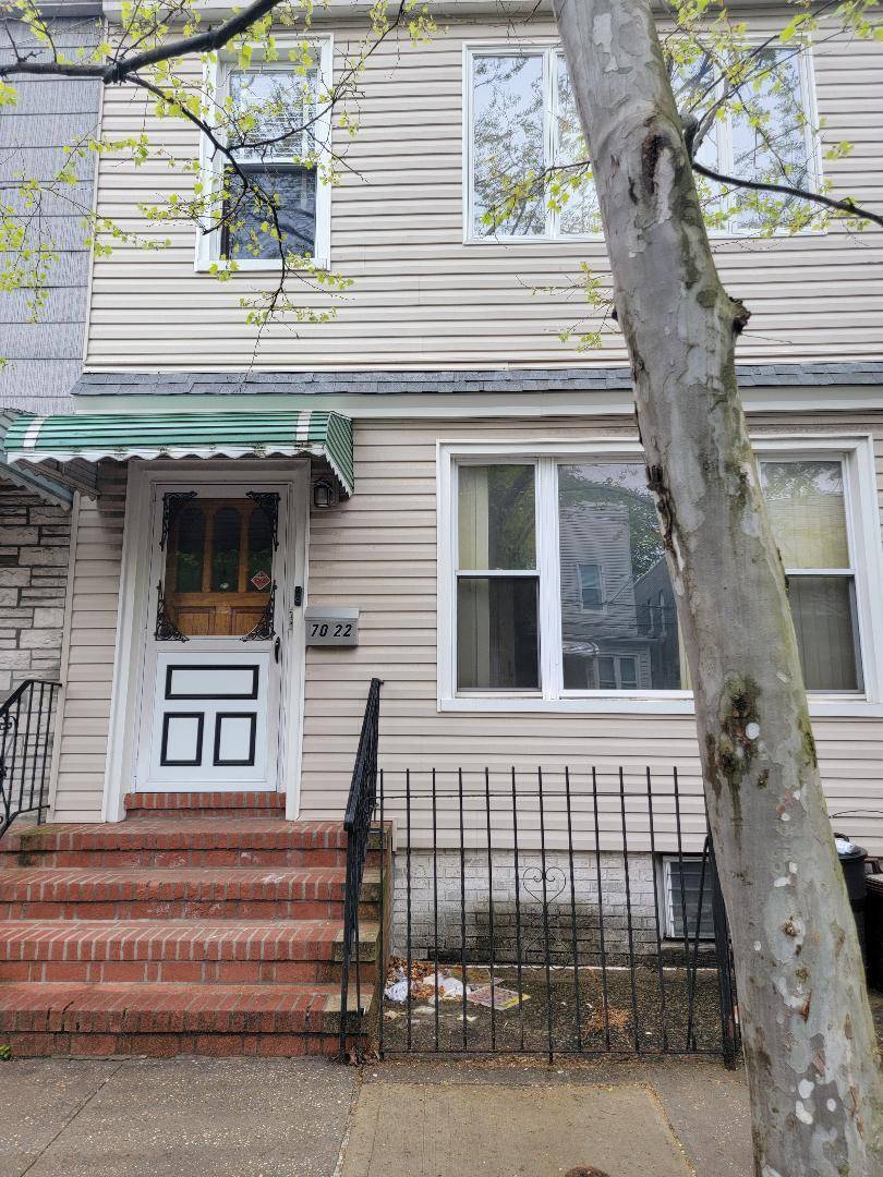 Beautiful semi detached 2 family home, with private yard and two car garage.