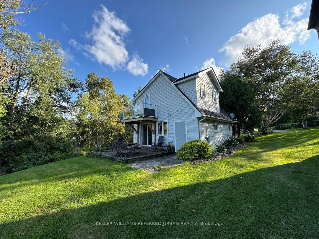 A private oasis on 4 acres of land, bordering a small lake.