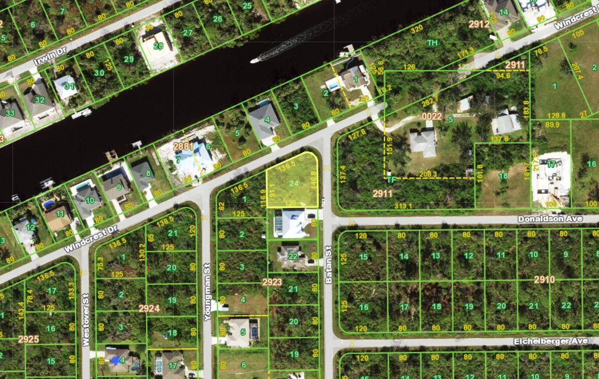 Oversized corner buildable lot with a view of the Apollo waterway that leads out to the Myakka River and Charlotte Harbor.