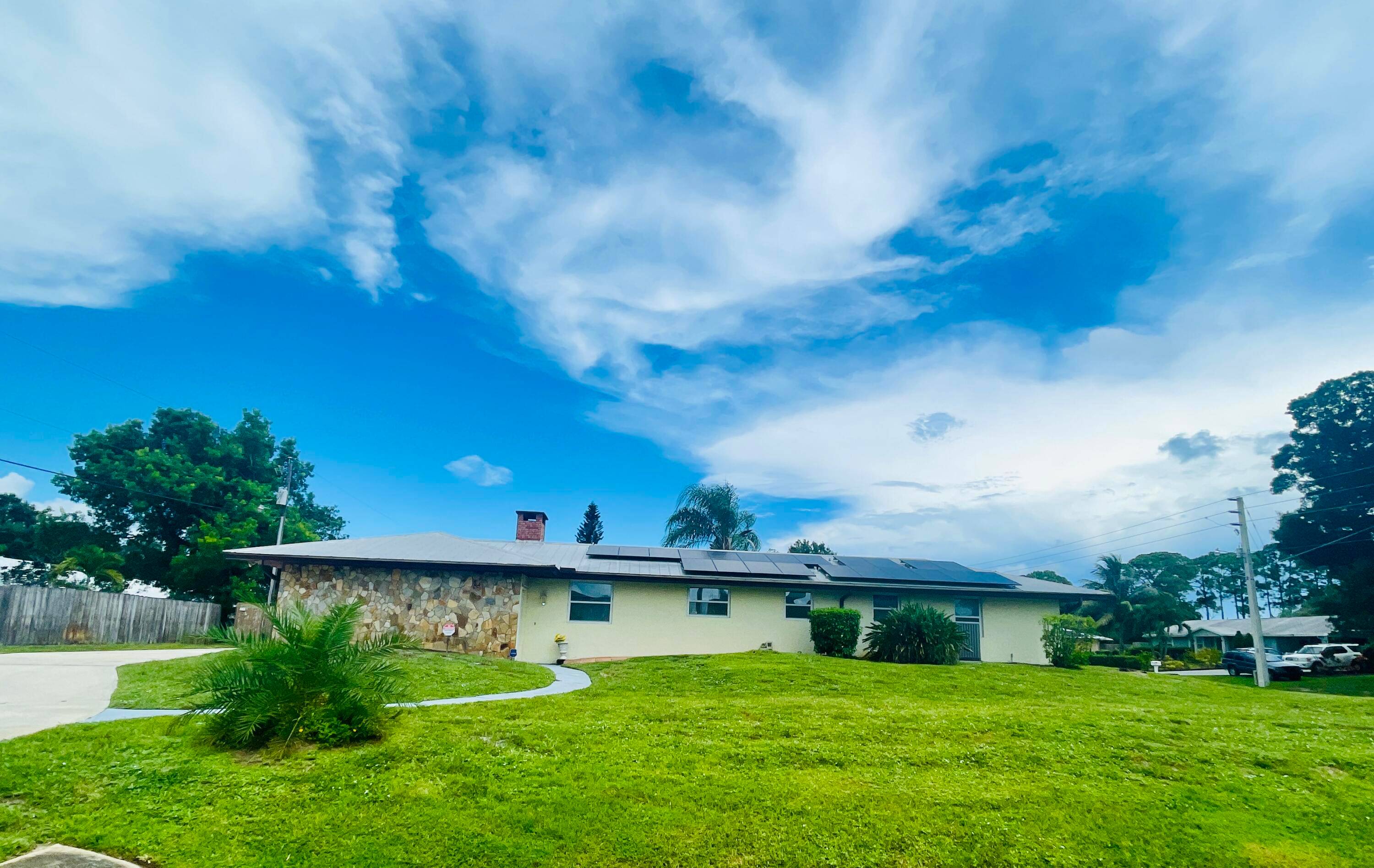 WOW ! LARGE CORNER LOT, Impact glass windows, metal roof, solar panels, whole home gas generator for security, separate gas tank for gas stove more !