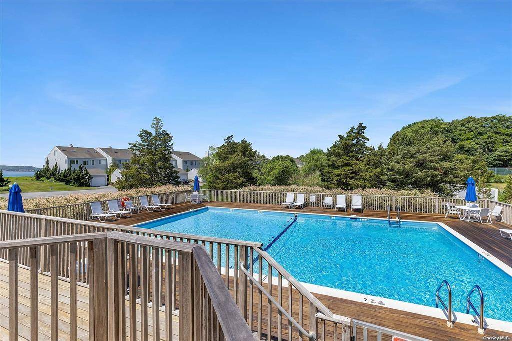 End unit first floor 2 Bedroom 2 bathroom condo with a full basement and garage at Cleaves Point Condominium complex.
