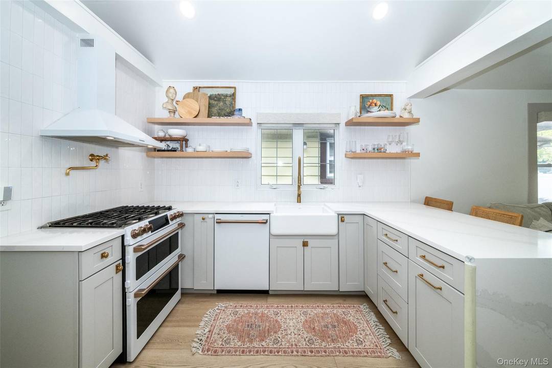 Move into this charming, fully updated home with a modern GE Cafe style kitchen and luxurious bathroom where comfort meets contemporary style and there is nothing to do but move ...