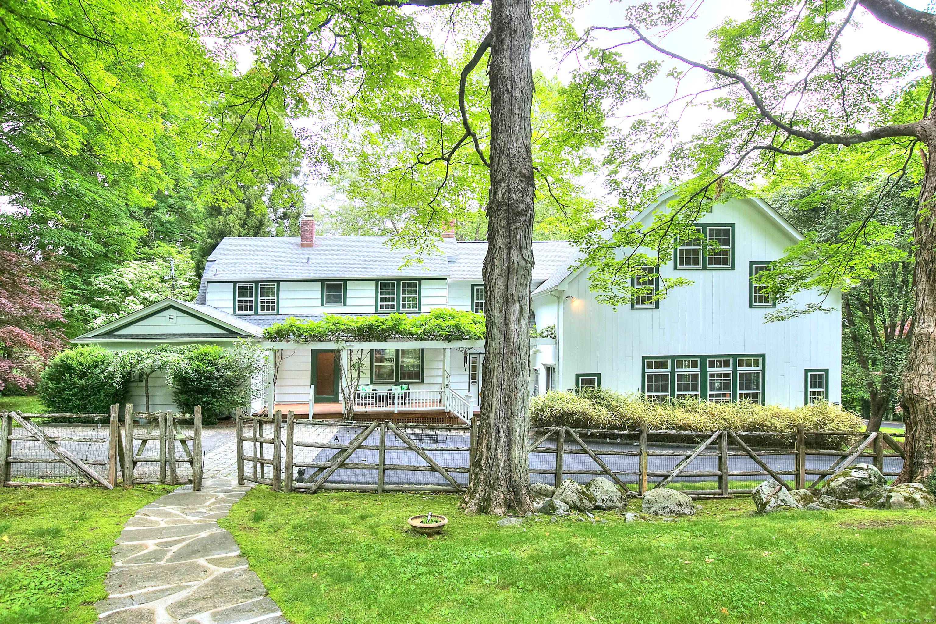 Quietly sited atop of a serene two acre lot, this wonderful home is a rare find.