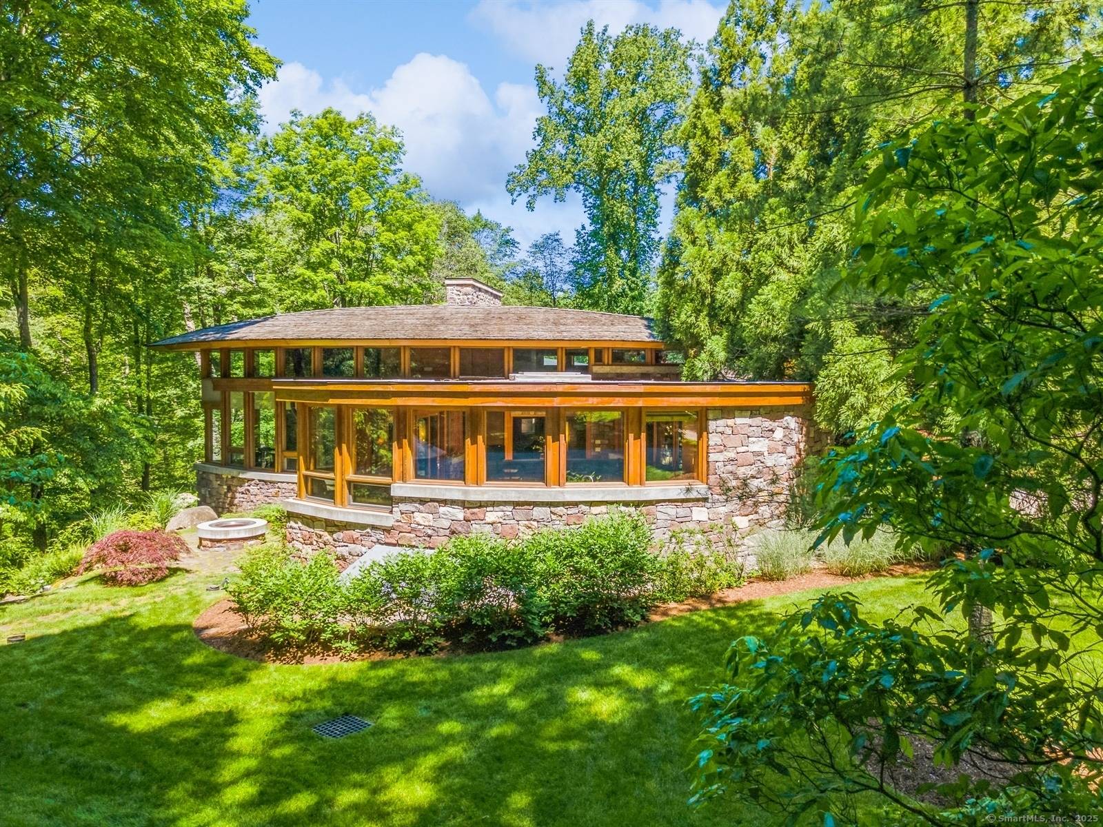 Experience the magic of organic architecture in this stunning John Howe designed masterpiece, where every detail tells a story of harmony and connection with nature.