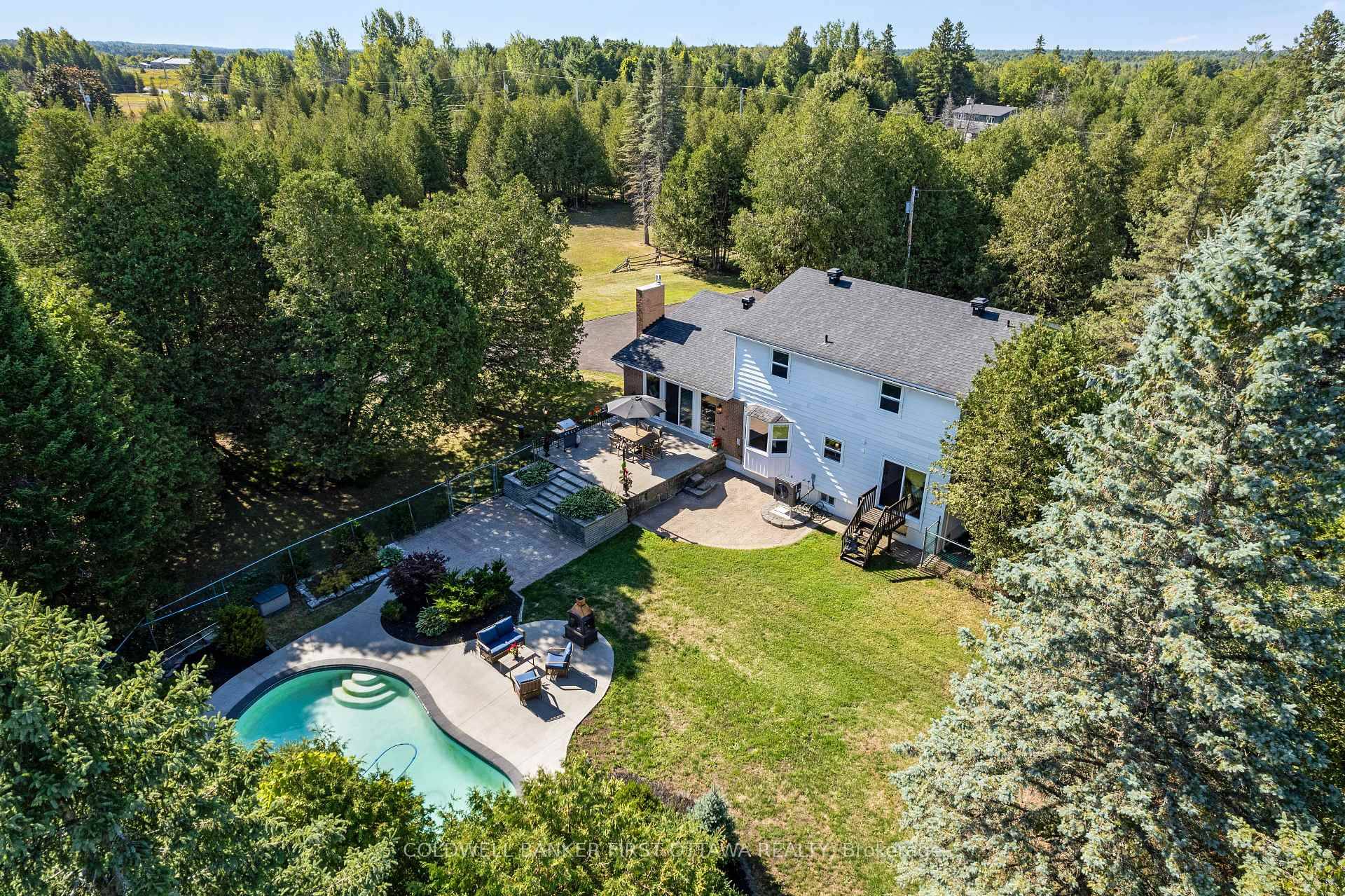 Tucked away on 24 acres of privacy and natural beauty, this country property offers space to spread out, breathe deep, and live comfortably, all just a short drive from town.
