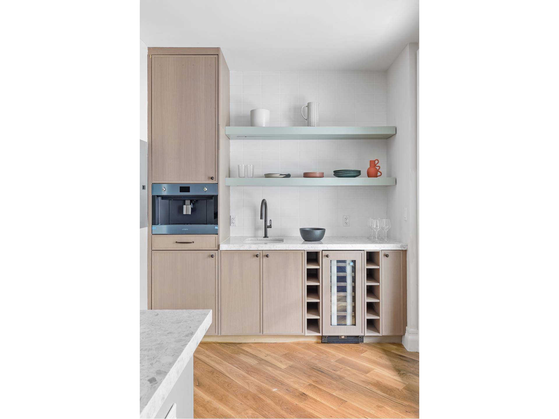 Unit 1 is a sprawling 1, 997 square foot, three bedroom triplex featuring a tranquil private garden, an additional terrace, and a spacious cellar.