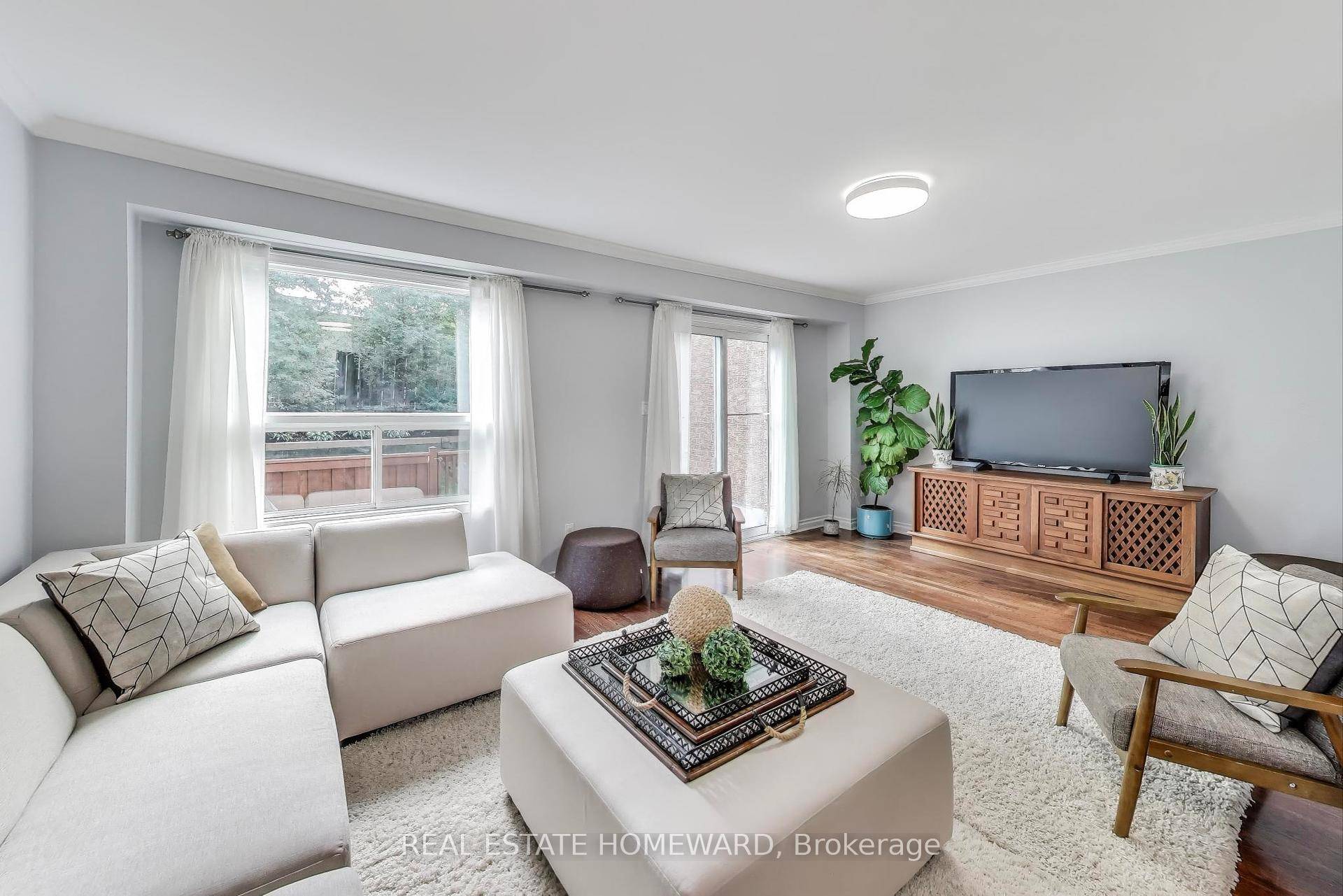 Modern, Renovated, Low Maintenance 4 Bedroom 3 bath Family sized Townhouse with Low Fees of only 410 m.