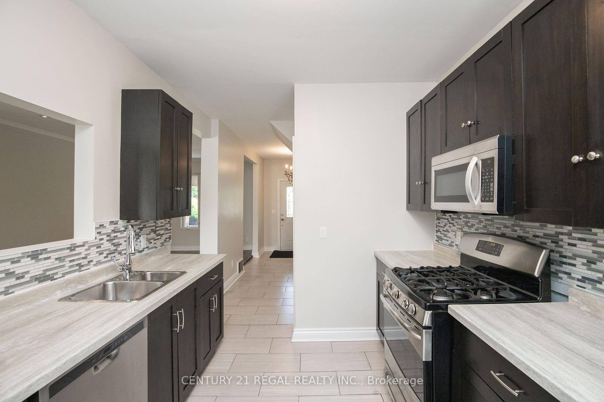 Welcome to this beautifully updated century home, offering a perfect blend of historic charm and modern convenience.