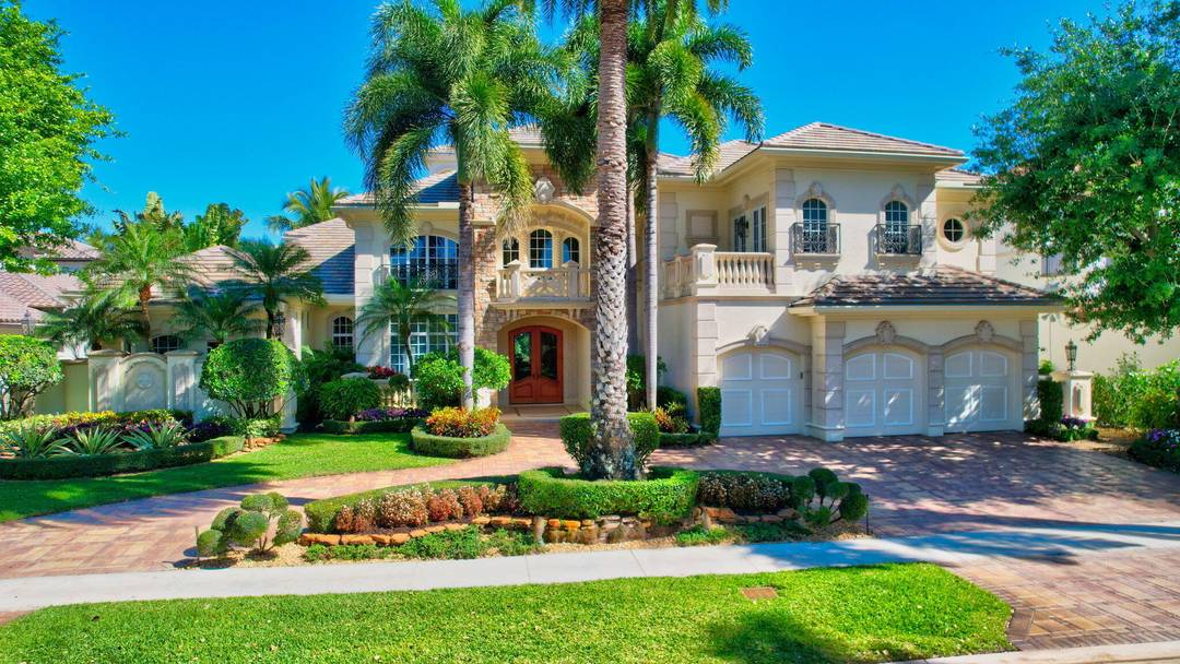 Custom built, luxury estate home with lake and golf course views, and full golf equity membership available, located on one of the best streets in Mizner Country Club !