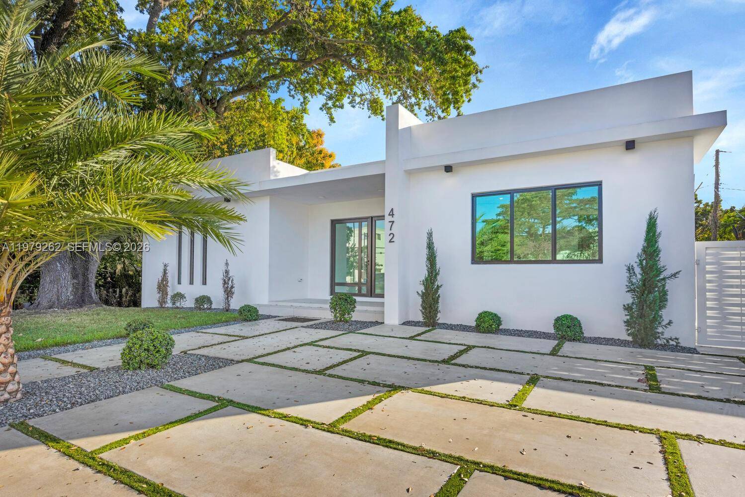 Experience modern living in Miami Springs with this newly built residence offering 4 spacious bedrooms amp ; 3.