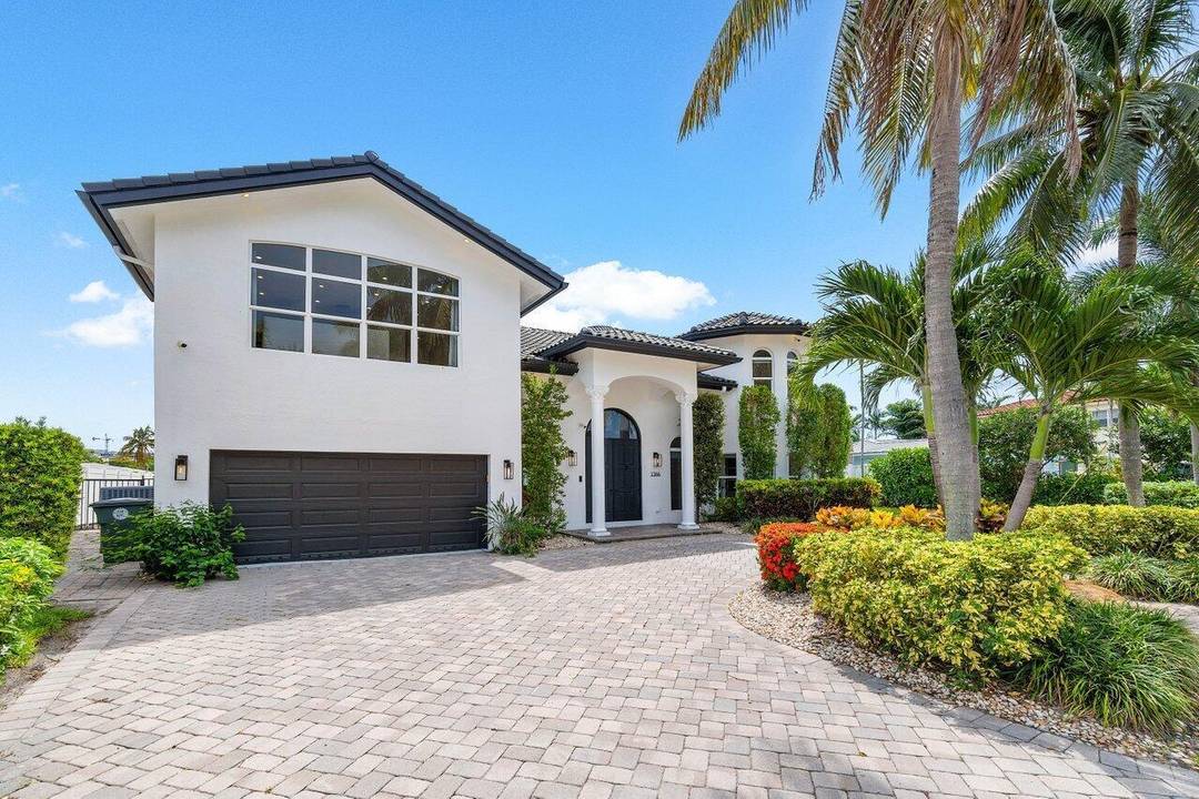 Experience luxury living in this like new fully furnished estate in highly sought after East Boca raton community, Boca Islands.