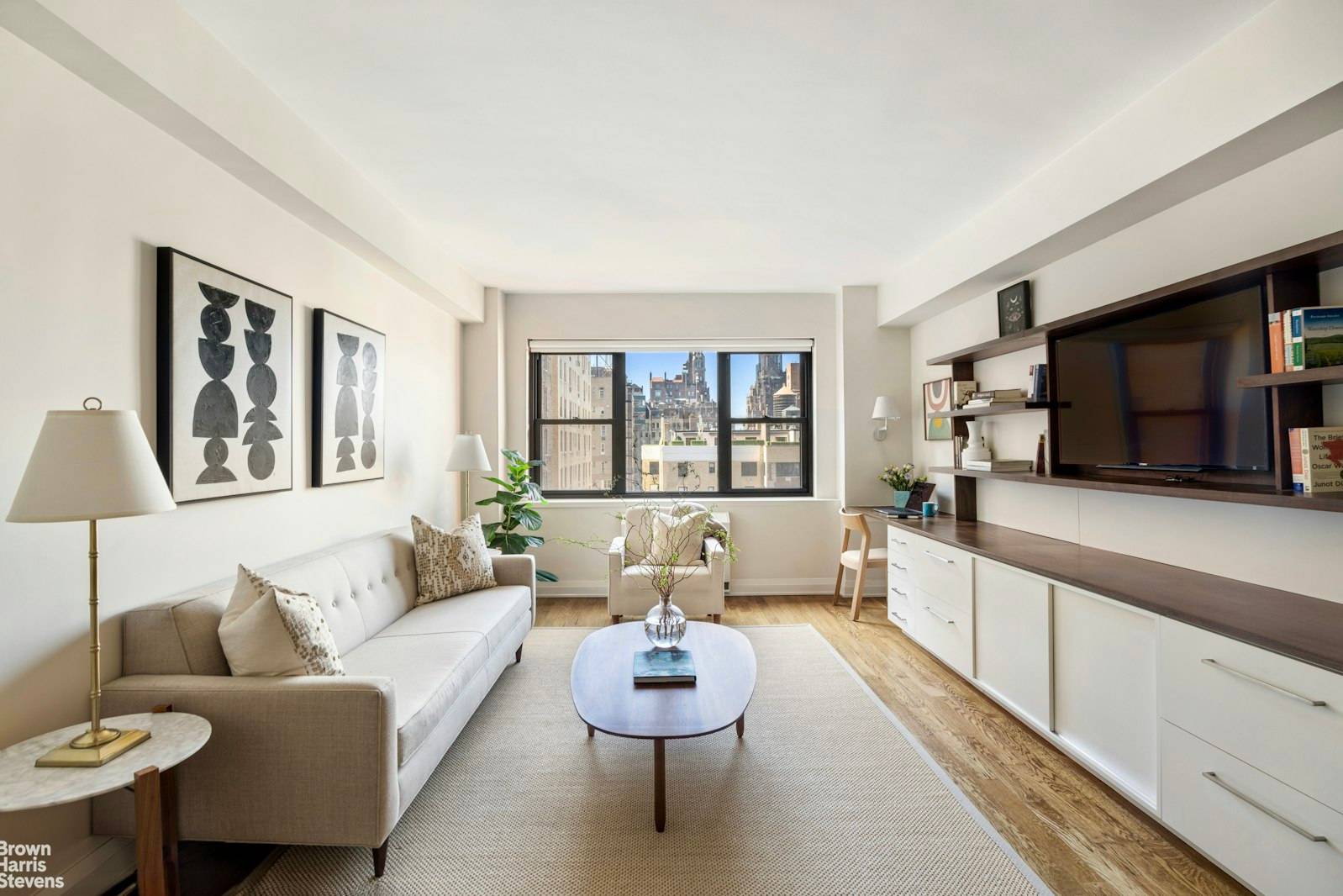 Welcome to Residence 14M at 165 East 72nd Street a new and sleekly renovated one bedroom home offering open western views and refined, sun filled interiors.