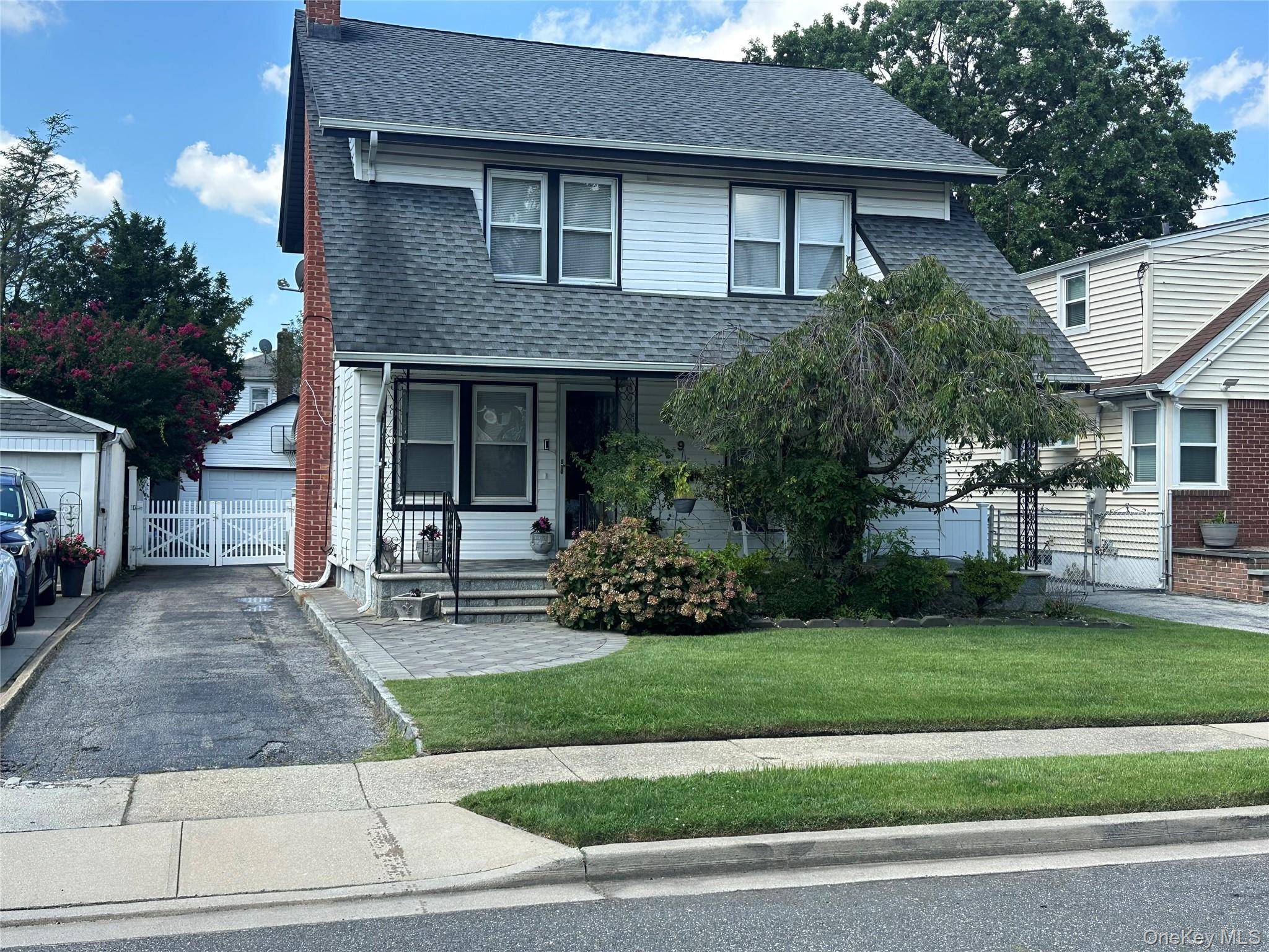 Nestled in Lynbrook, this inviting residence sits on a spacious 40x125 foot lot with a 2 car garage and a semi above ground pool.