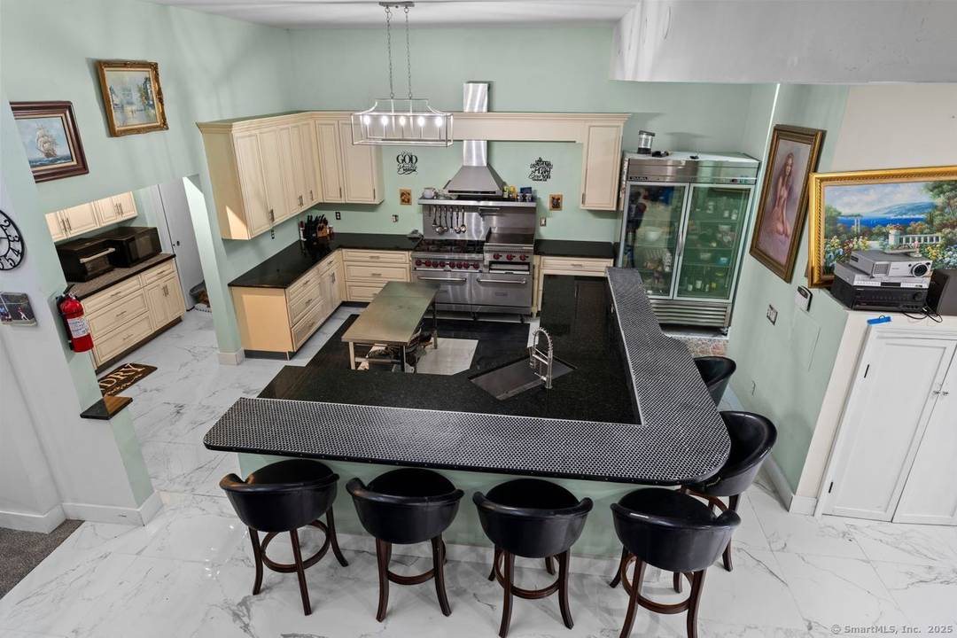 Welcome to this stunning, rarely available contemporary new construction at the end of a quiet cul de sac with partial views of Moodus Reservoir.