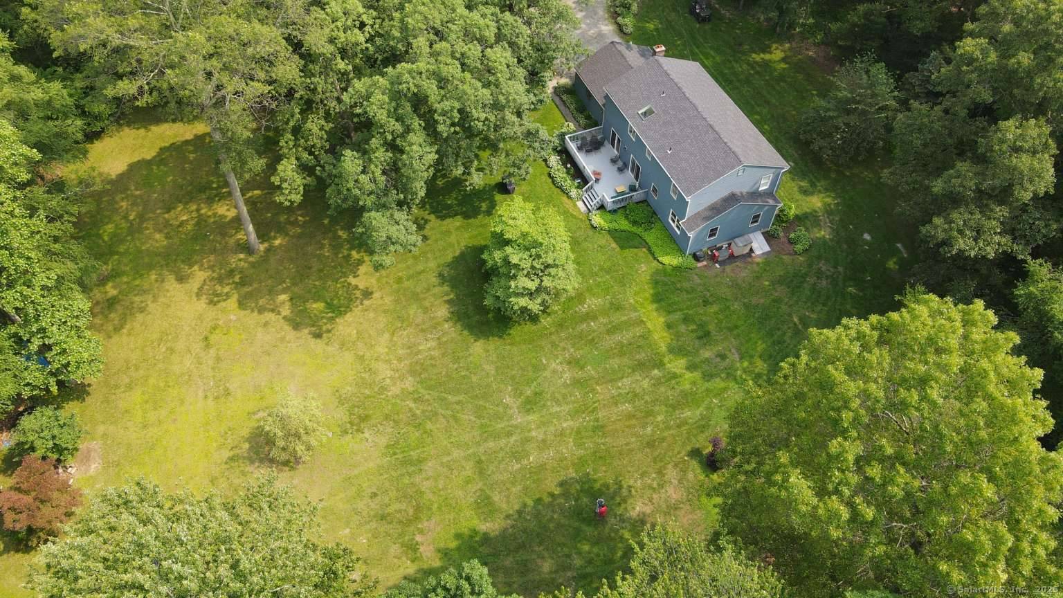 Nestled in a peaceful wooded setting, this beautifully maintained 4 bedroom, 2.