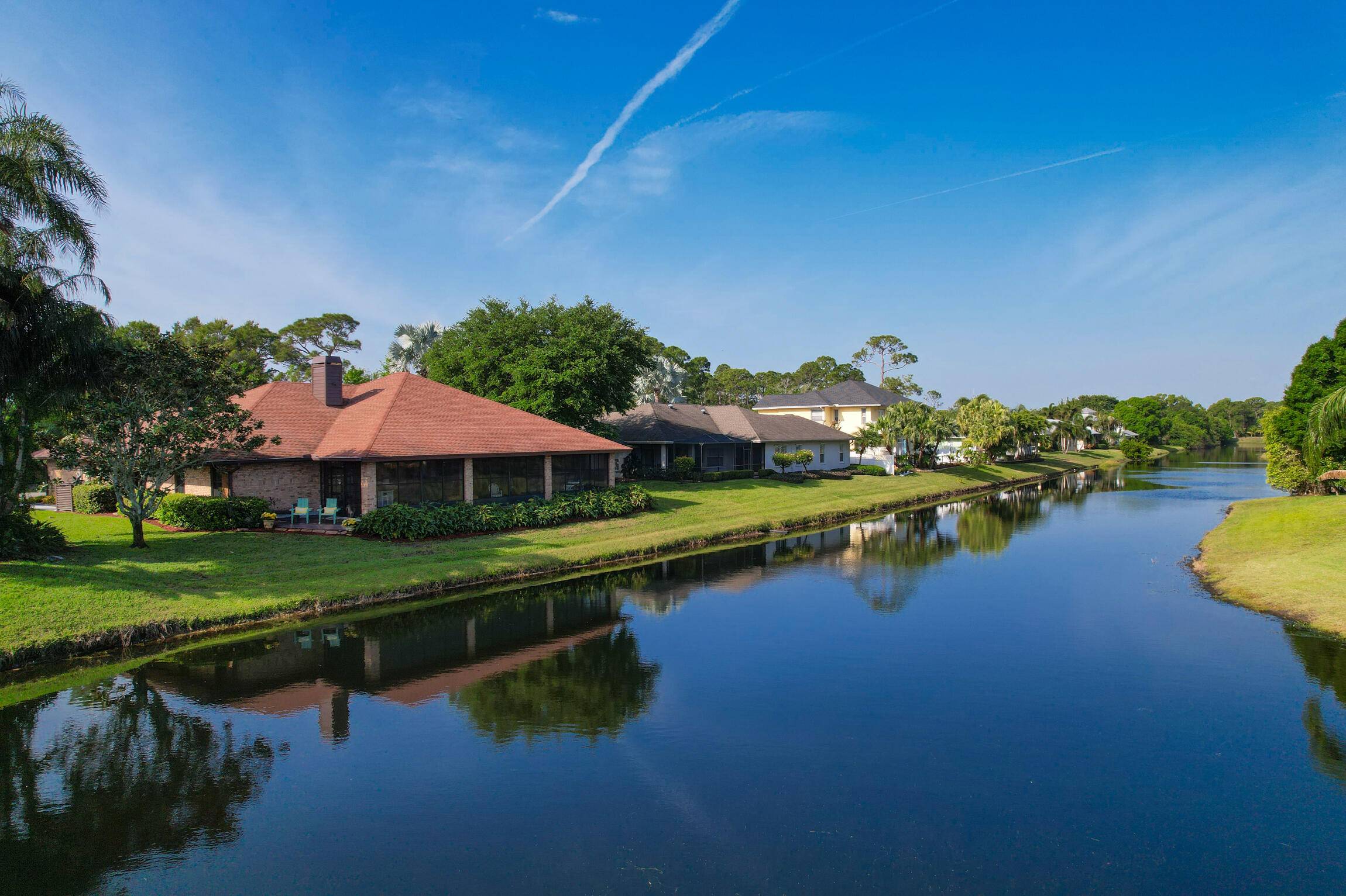 This is it ! Beautifully remodeled 3 bedroom, 2 bathroom brick home offering spectacular lake views in the desirable Oak Ridge community of Palm City !