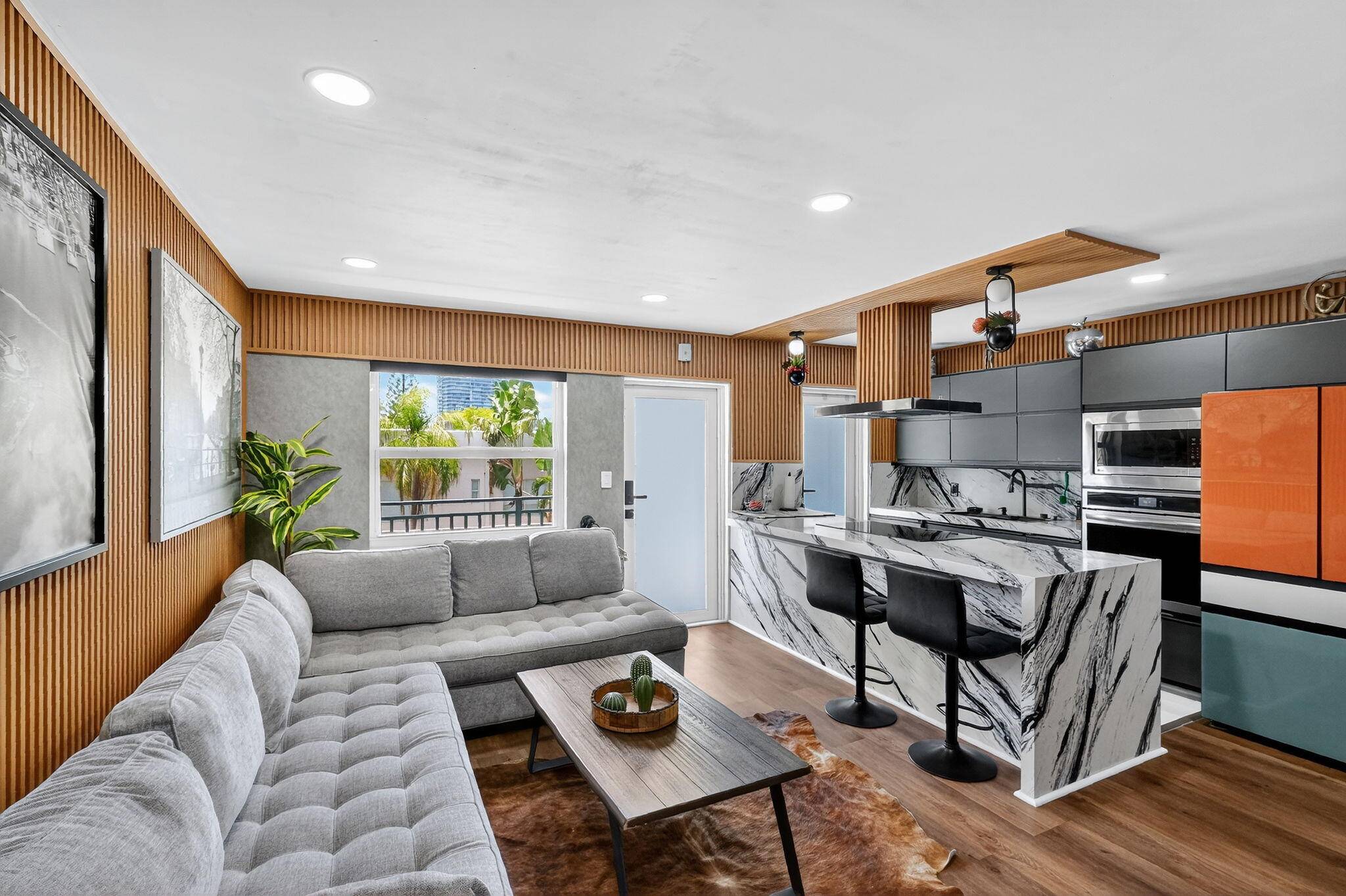 Own a stylish retreat in South of Fifth just 2 blocks from the beach.