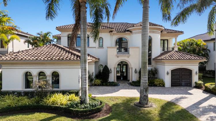 Meticulously designed and built in 2015, this exceptional lakefront estate embodies timeless elegance and modern luxury within The Oaks, one of Boca Raton's most prestigious gated communities.