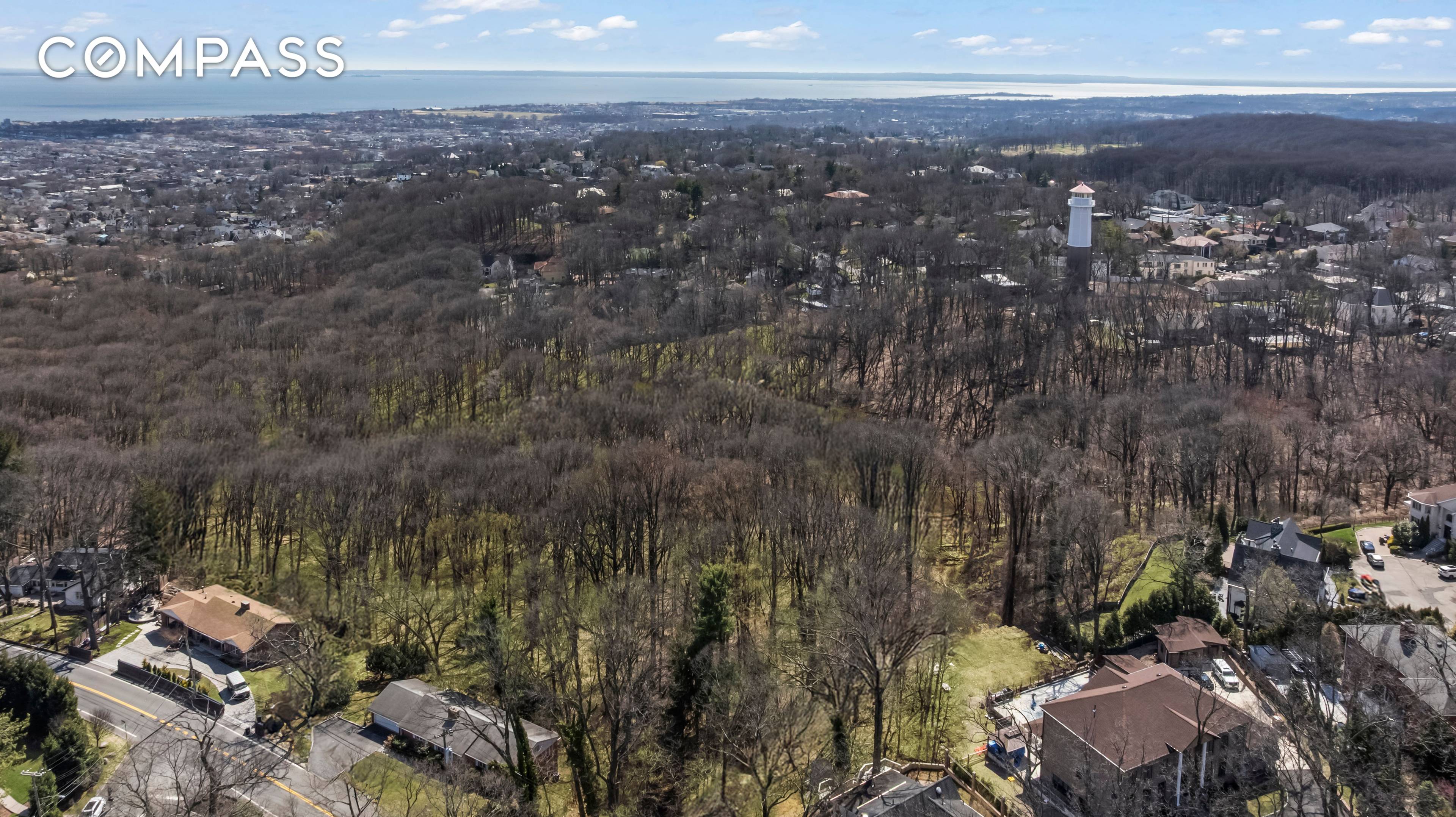 Nestled in the hills of the prestigious Todt Hill section of Staten Island, lies almost two acres of pristine land in NYC, just 30 minutes to downtown Manhattan !