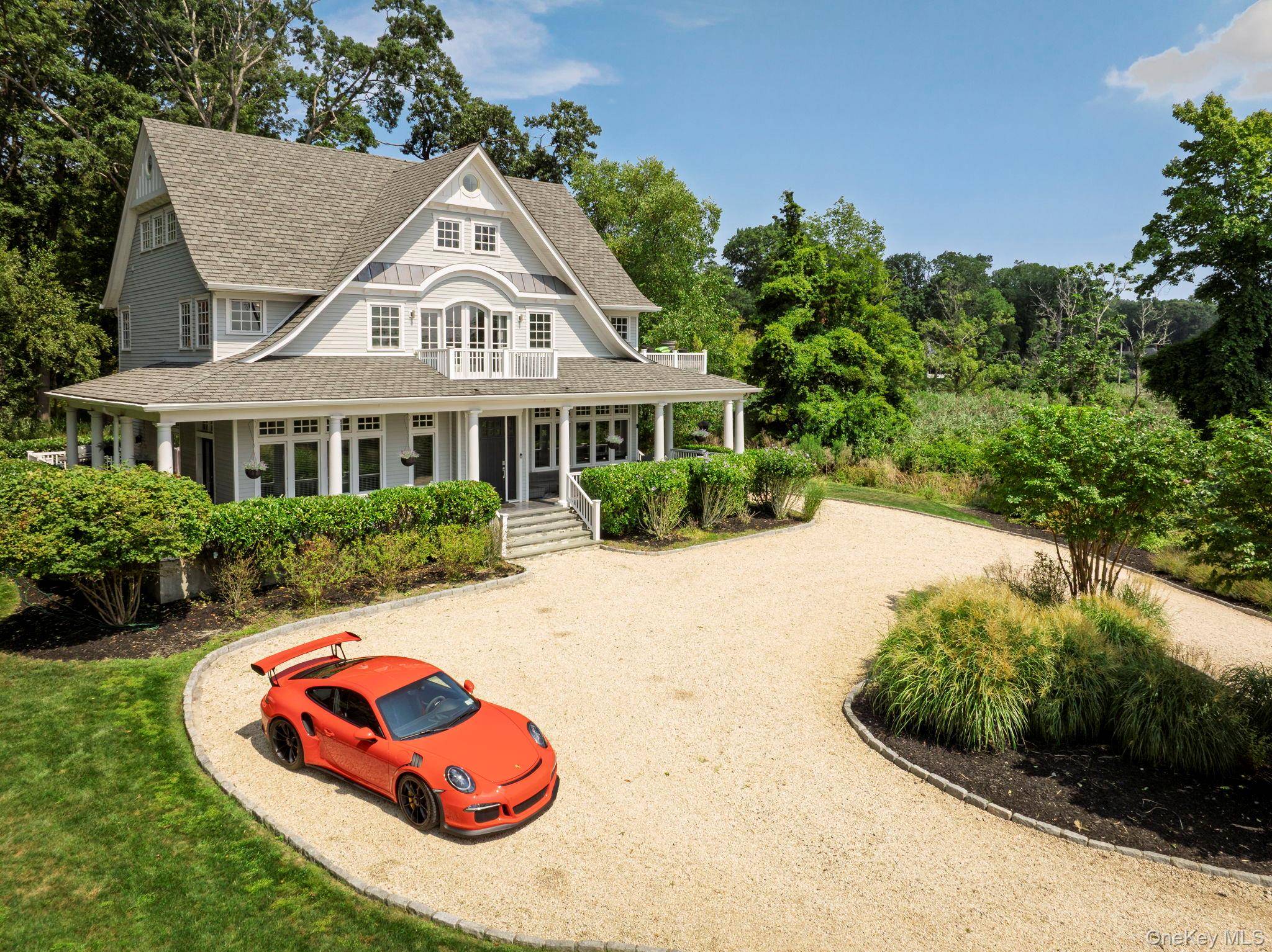 Enjoy spectacular 180 degree water views and timeless Hamptons style at Harbor Lights, a nine year old custom home perched on the shores of Lloyd Harbor.