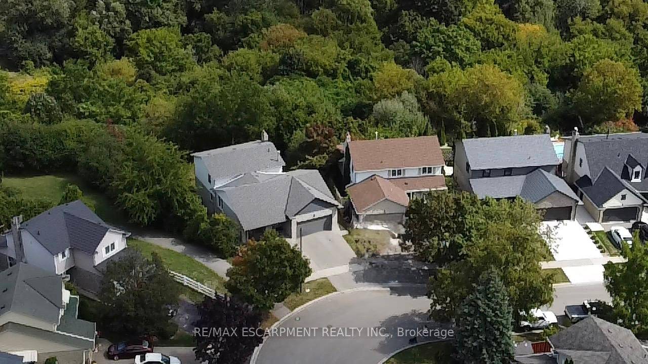 Ravine lot, located in a serene setting surrounded by mature trees, stunning 5 level back split offers complete privacy with over 3, 000 sqft.