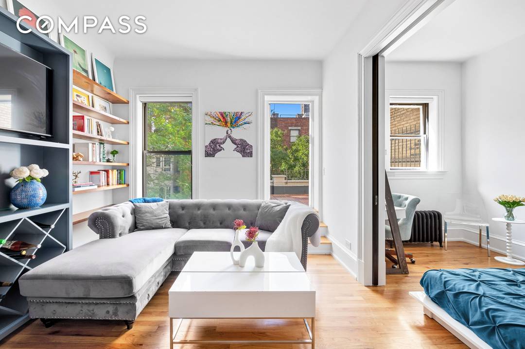 On a landmarked, double wide block rests a meticulously maintained pre war brownstone building.