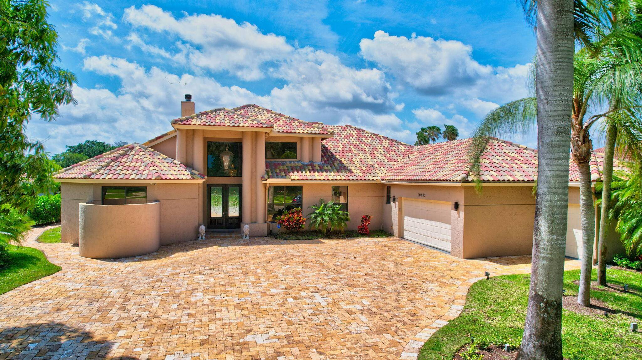 Rent this luxurious 4BR, 3BA home with stunning lake and golf course views in the exclusive Stonebridge Country Club.