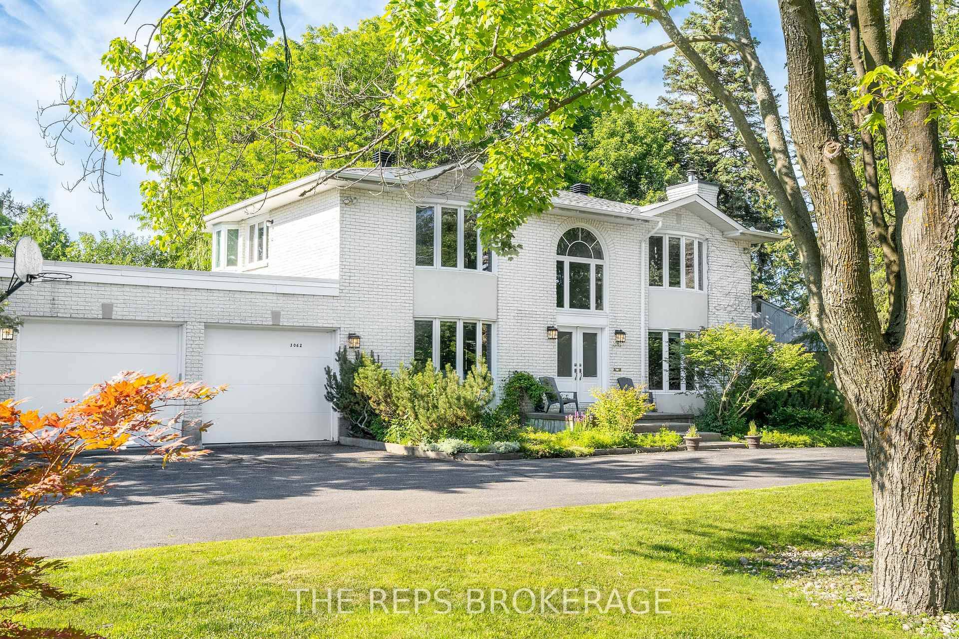 Prestigious Revelstoke Estate Expansive Lot Fully Renovated Stately all white brick 4 bedroom 4 bathroom home in the coveted Revelstoke community that blends timeless elegance with top to bottom renovations ...