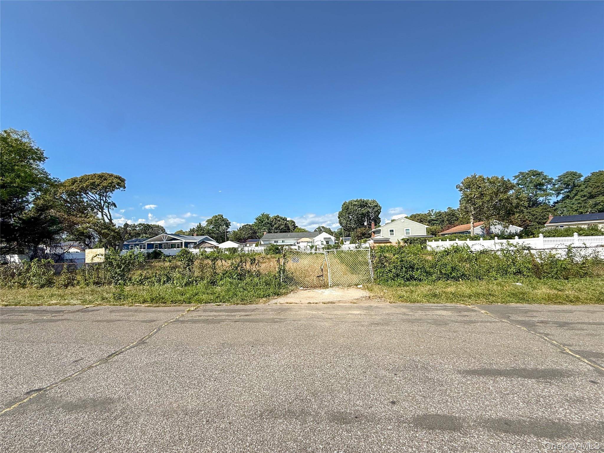 Land nestled on a spacious 125 x 100 lot in a quiet Lindenhurst cul de sac, this property offers a prime development opportunity with subdivision potential.